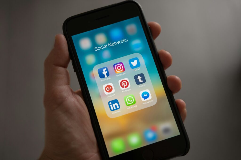 Smartphone displaying social media app icons. Social Media for Small Business Marketing.