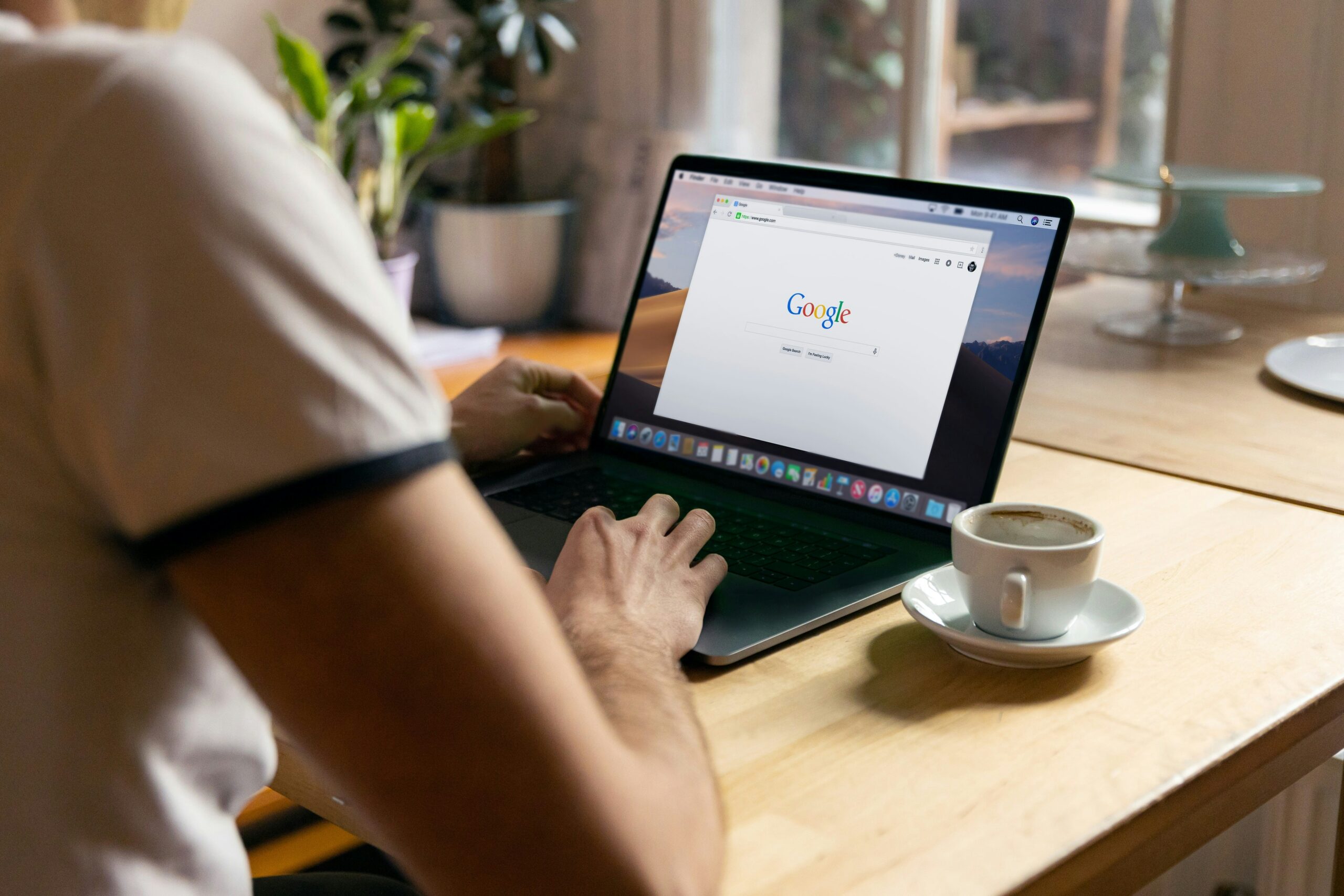 person using black laptop computer creating an effective Google Ads Landing Page